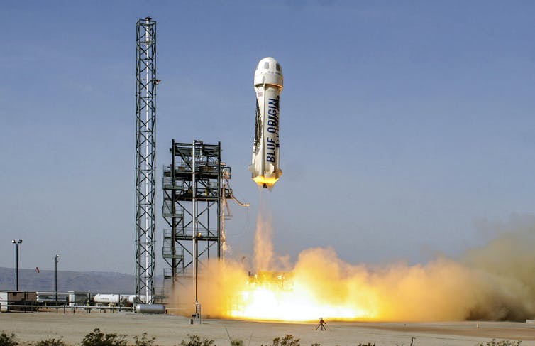 The Blue Origin launches.