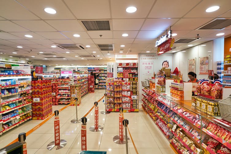 Chocolate and sweets on display by tills in grocery store
