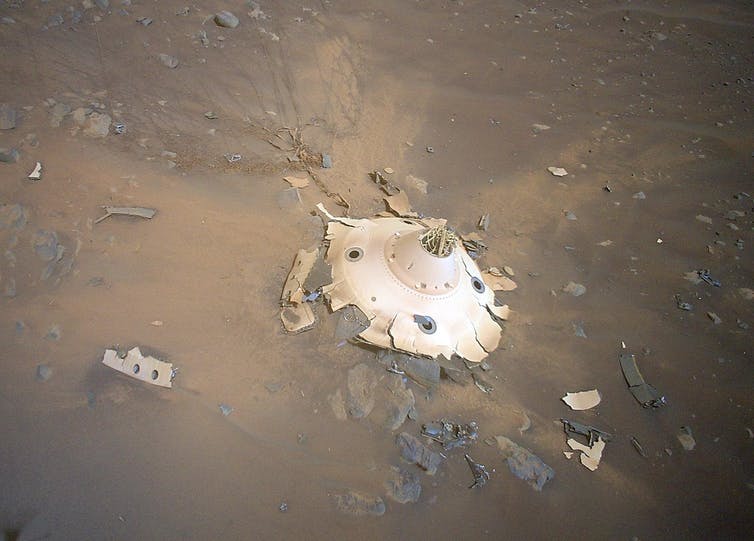 Image of wreckage, deliberately crashed on Mars, seen from above.