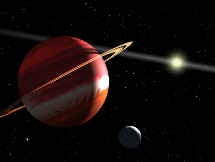 Red planet with ring and distant star